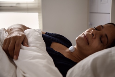 Woman sleeping with sensor